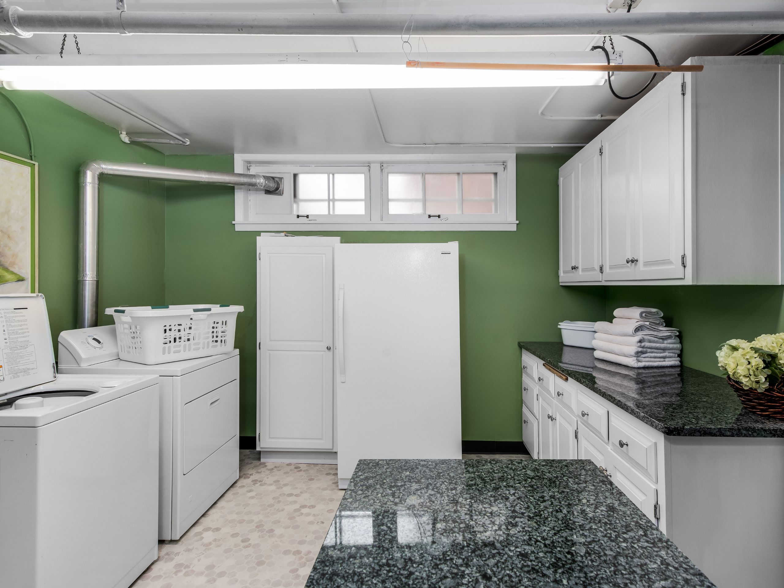 what's the story, basement laundry room, countertops, cabinets, refridgerator