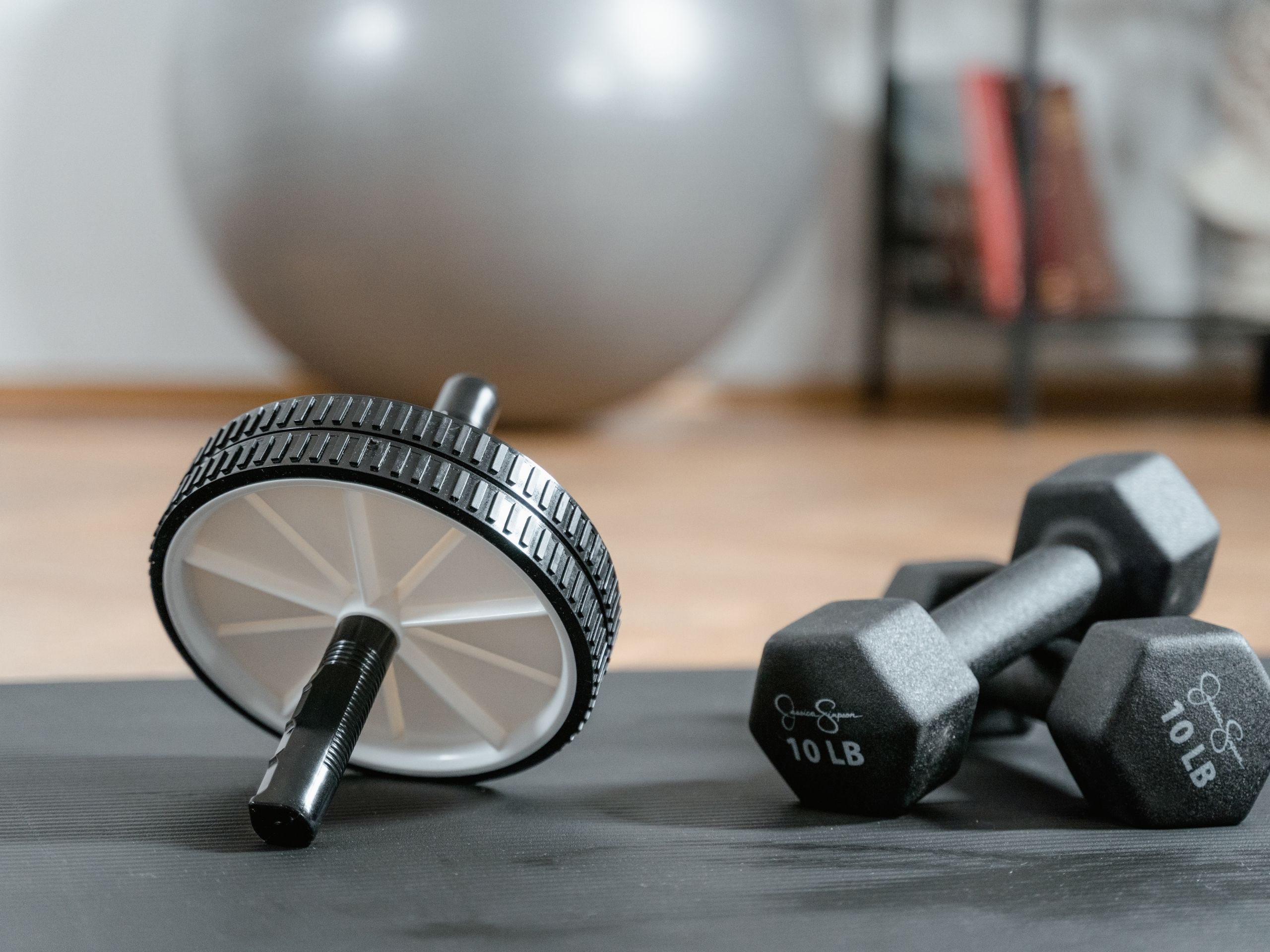 basement remodeling ideas: Workout equipment - ab wheel and weights