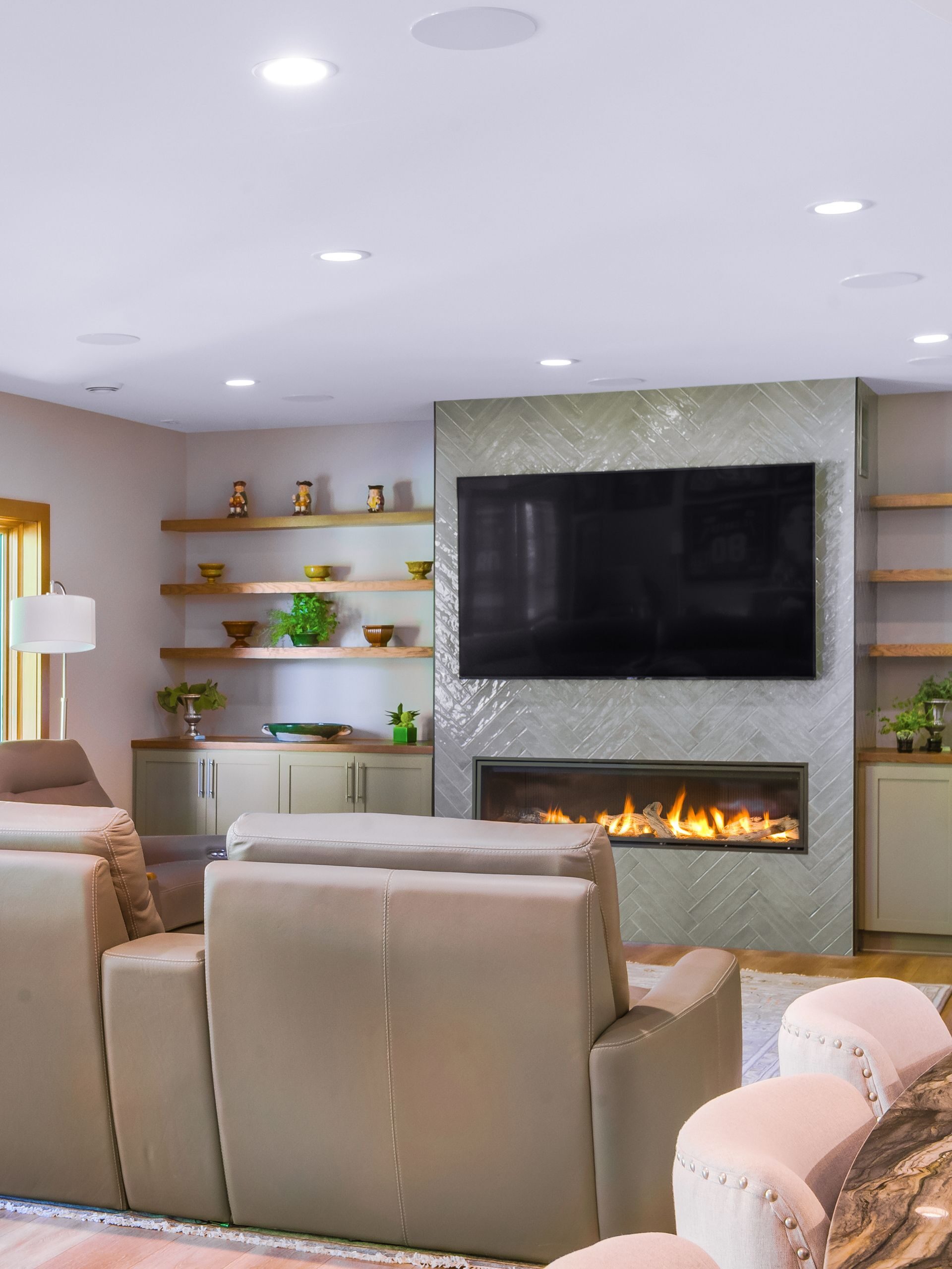 fireplace with TV and reclining sofa