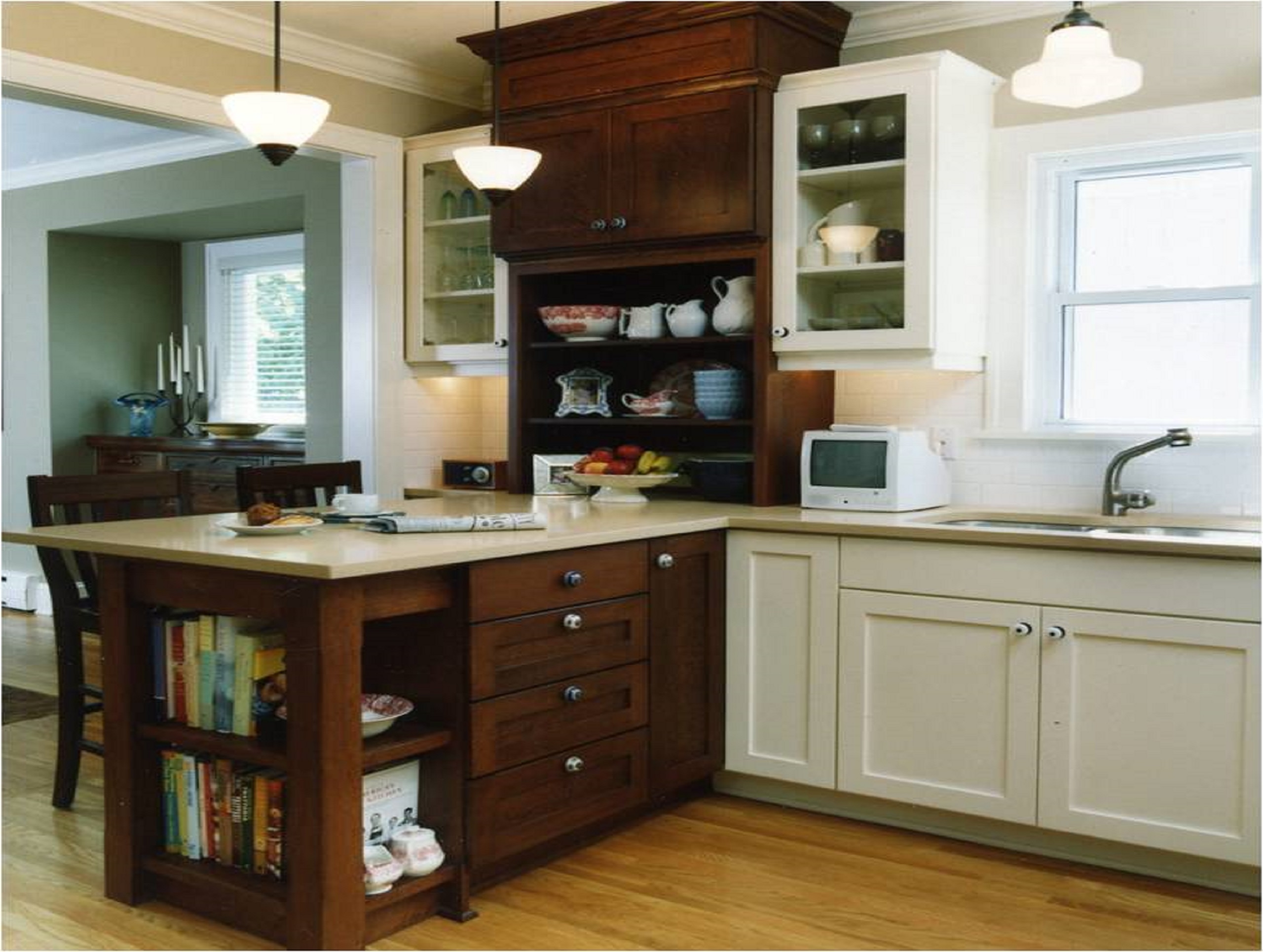 Remodeled timeless kitchen with storage space, a sink, windows, and a connected dining room.