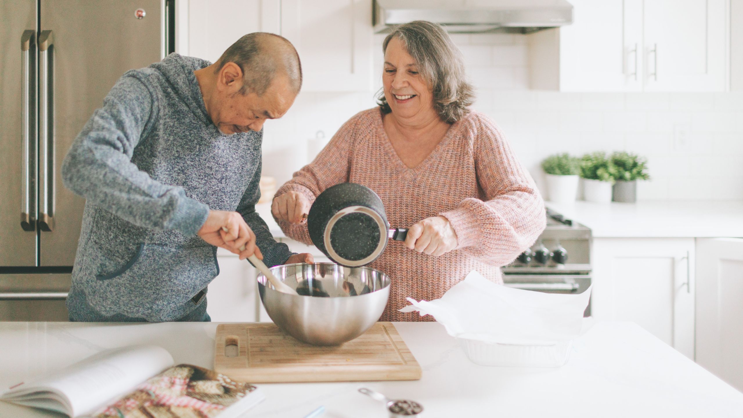 couple cooking in kitchen 