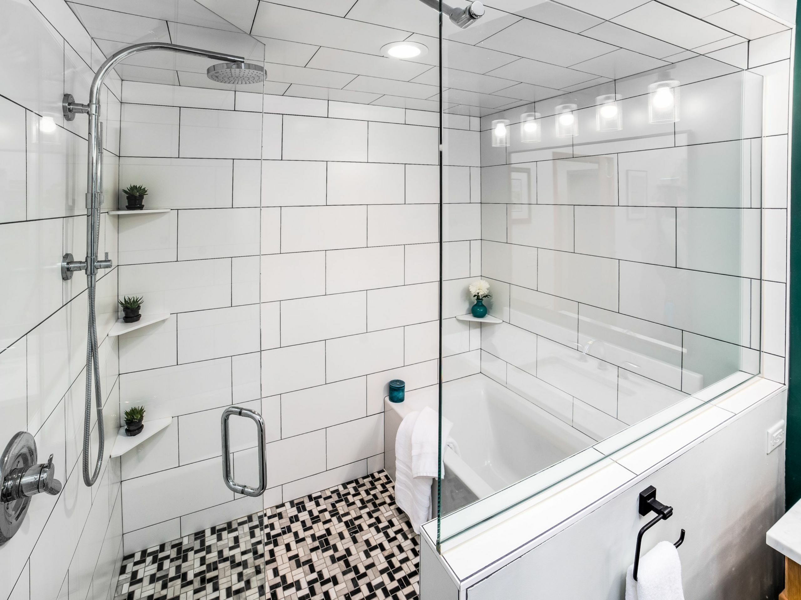 bathroom expansion remodel with white shower, tub