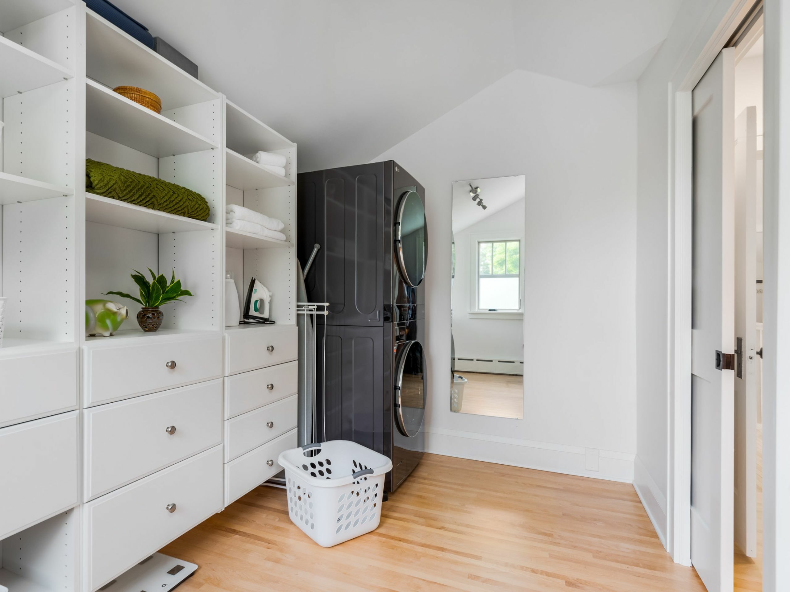 second-story bungalow renovation white bedroom closet with laundry