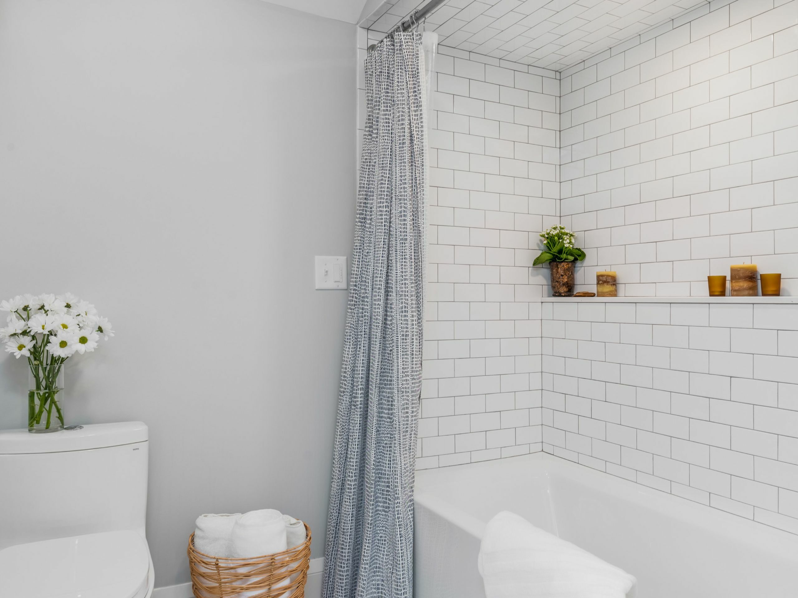 second-story bungalow renovation white bathroom shower