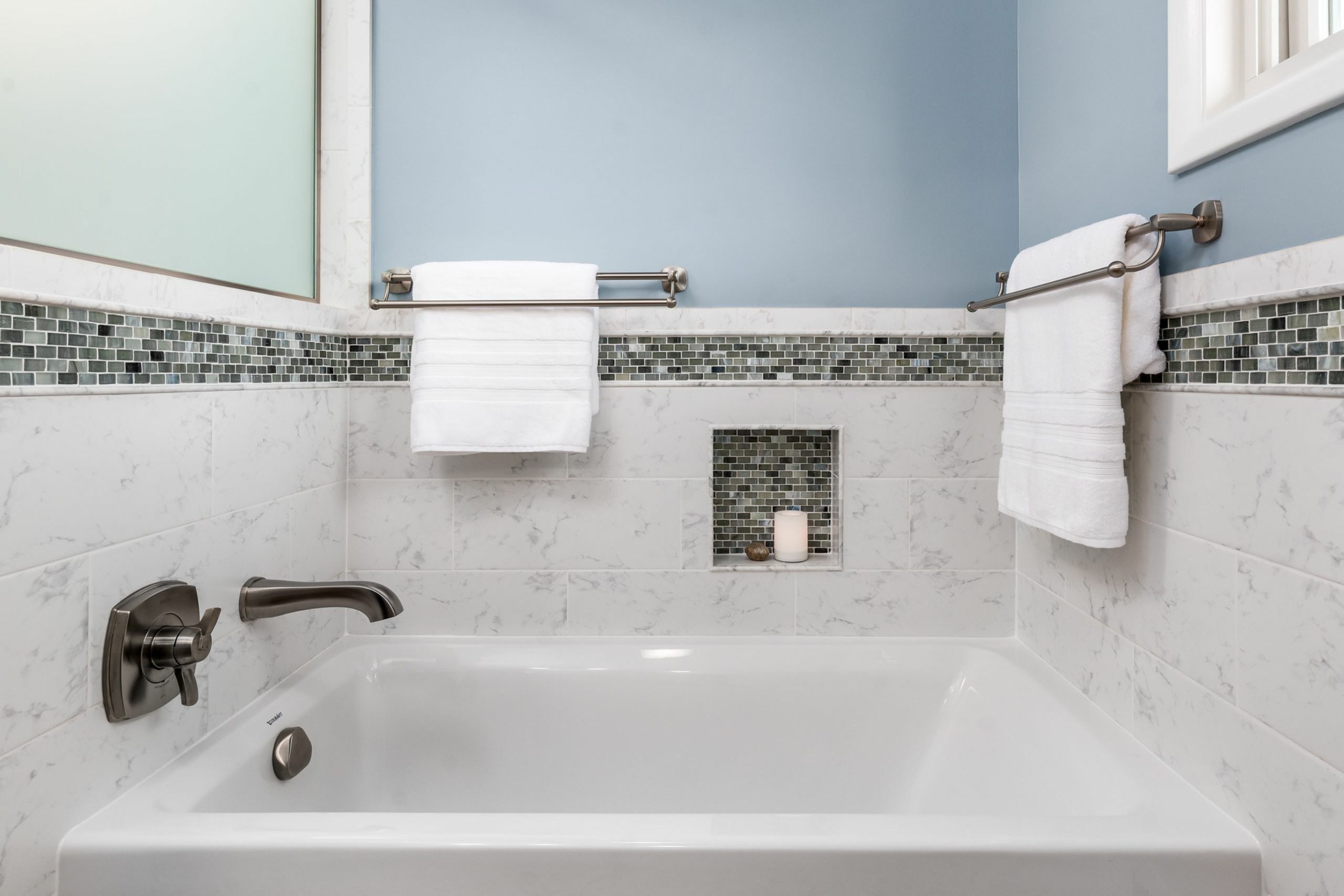 home remodeling tips include a soaking top with shower niche for candles