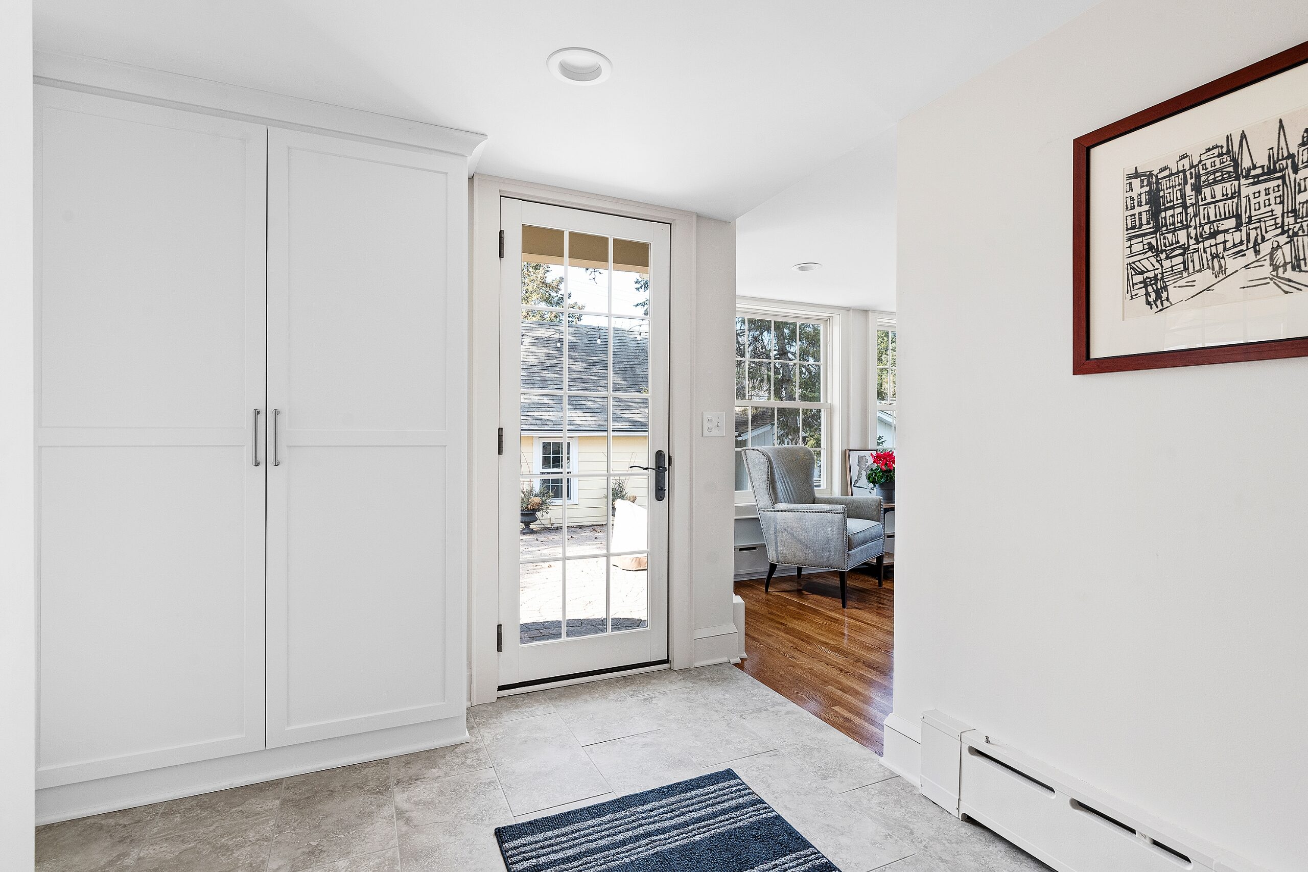 white mudroom with cabinets