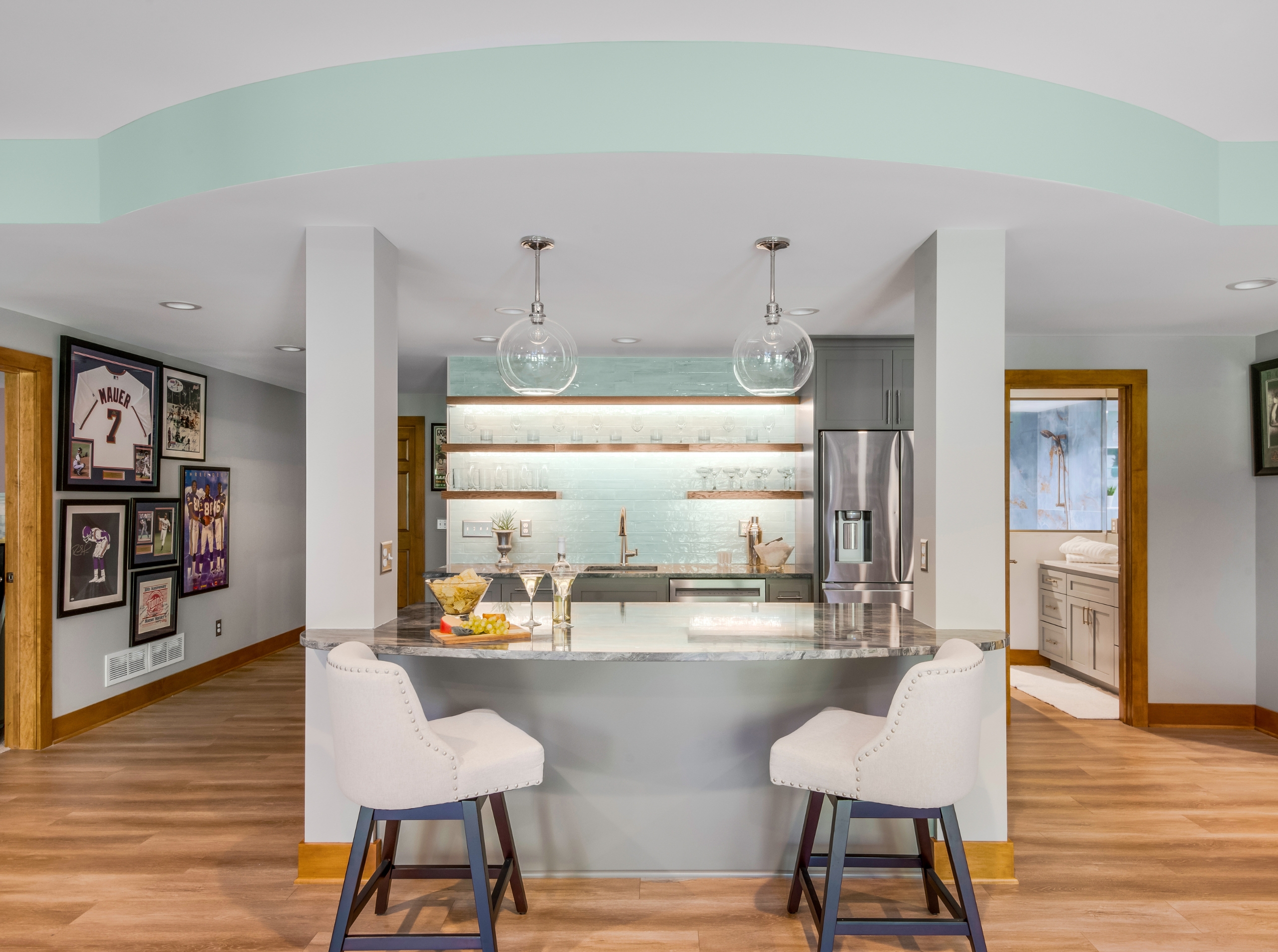 bar with overhang island and two stools